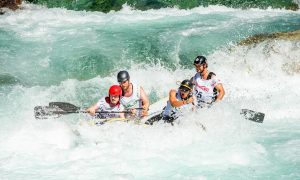 group of people kayaking on body of water