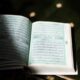 white book page on brown wooden table