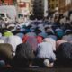 people kneeling and praying during daytime