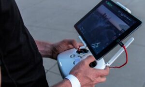 person holding quadcopter controller