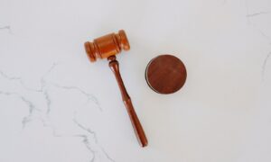 brown wooden smoking pipe on white surface