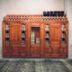 brown wooden door on gray concrete wall