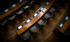 low light photography of armchairs in front of desk