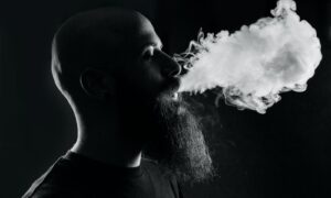 man smoking with black background