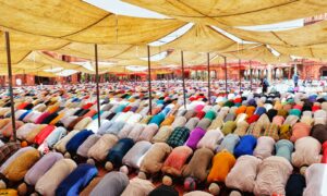 people bowing down inside canopy during day