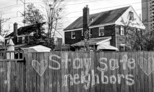 grayscale photo of wooden fence