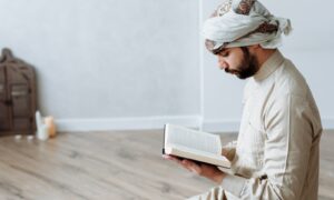 A Man Reading Quran