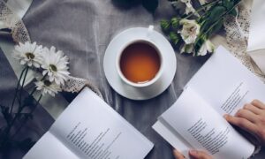 white cup with saucer near bok