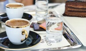 white ceramic cup on table