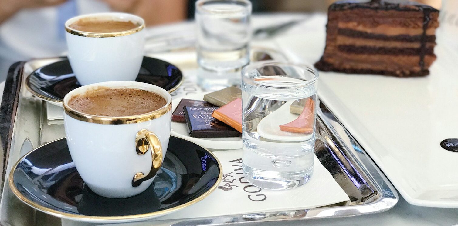 white ceramic cup on table