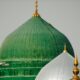 a green dome and a white dome on a building